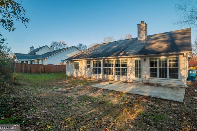 back of property featuring a patio