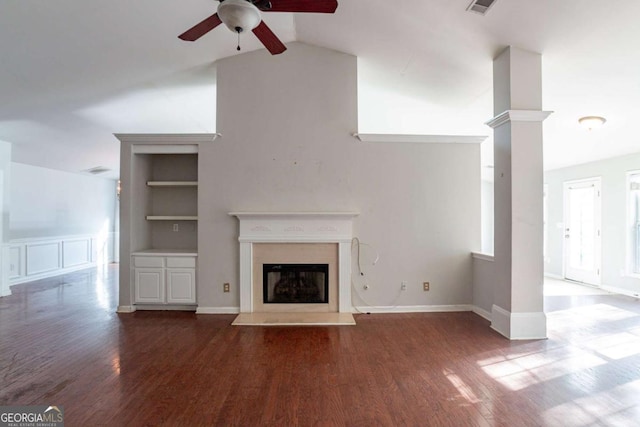 unfurnished living room with hardwood / wood-style flooring, built in features, ceiling fan, and lofted ceiling