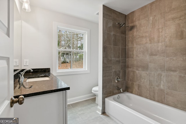 full bathroom with tile patterned floors, vanity, toilet, and tiled shower / bath