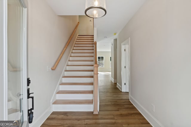 stairway with wood-type flooring