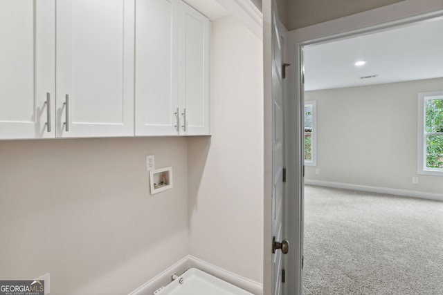 clothes washing area with carpet flooring, hookup for a gas dryer, cabinets, and hookup for a washing machine