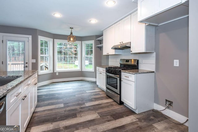 kitchen featuring dark wood-type flooring, stainless steel appliances, light stone counters, decorative light fixtures, and white cabinets