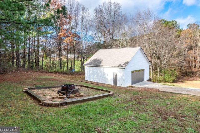 exterior space featuring a lawn and a garage