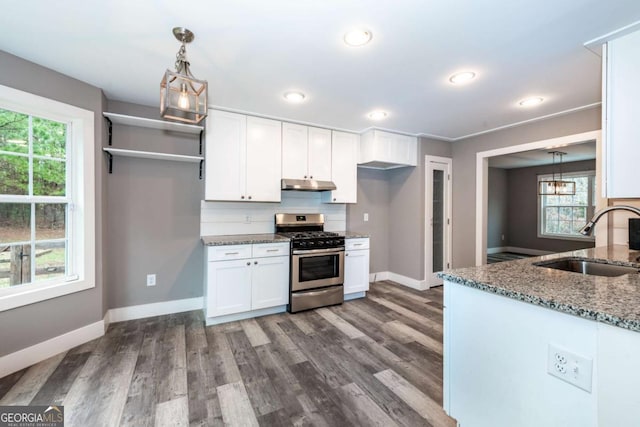 kitchen with gas range, white cabinetry, a wealth of natural light, and sink