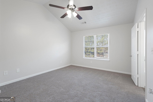 unfurnished bedroom featuring ceiling fan, carpet, and lofted ceiling