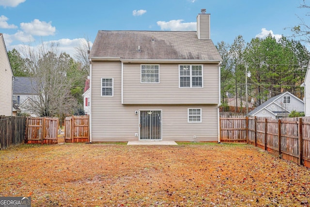 rear view of house featuring a patio