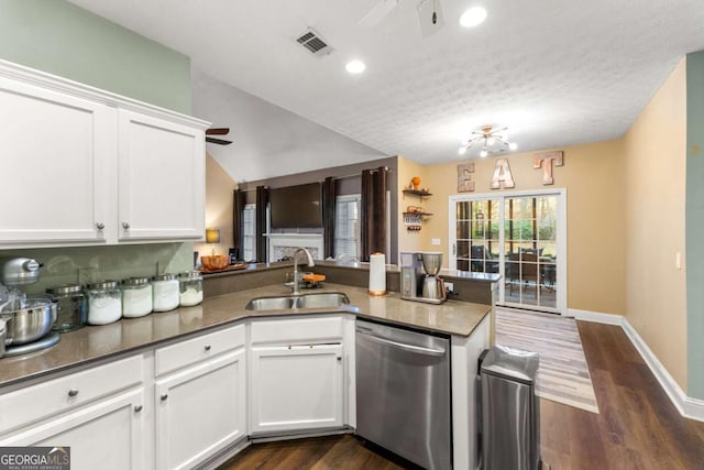 kitchen with dishwasher, kitchen peninsula, white cabinetry, and sink