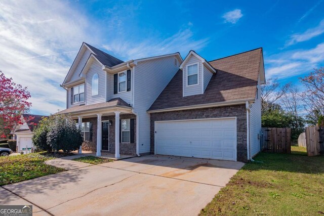 front of property featuring covered porch and a front yard