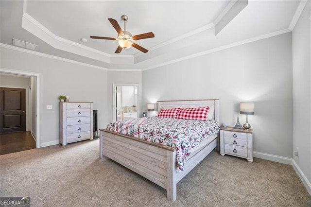 bedroom with baseboards, ceiling fan, carpet, a tray ceiling, and crown molding