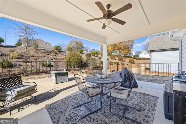 view of patio / terrace with outdoor dining area, a fenced backyard, and ceiling fan