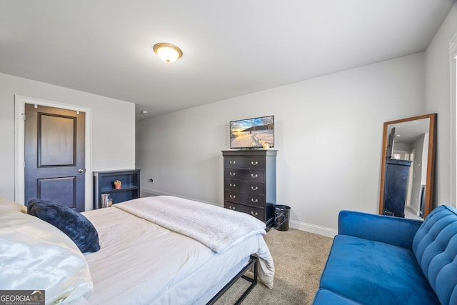 carpeted bedroom with baseboards