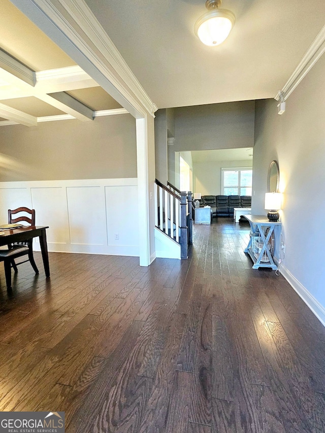 interior space featuring ornamental molding, wainscoting, stairway, and wood finished floors