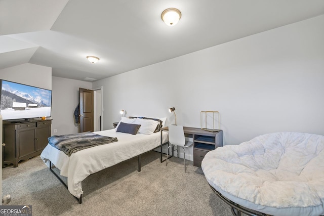 bedroom with light carpet and lofted ceiling