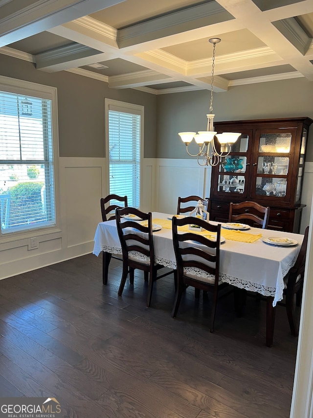 dining area with a notable chandelier, dark wood-style flooring, wainscoting, and a healthy amount of sunlight