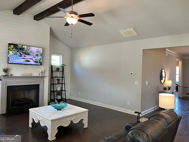 living room with dark wood-style flooring, a fireplace, lofted ceiling with beams, and baseboards