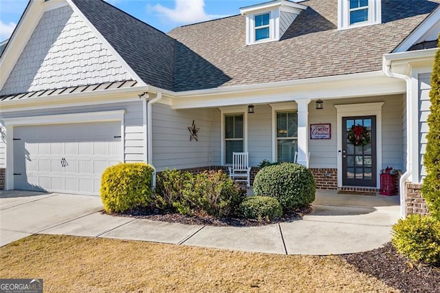 view of front of home featuring a garage and covered porch