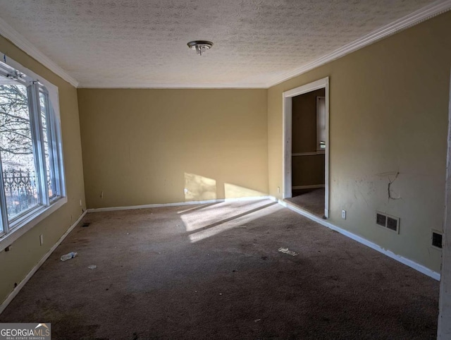 carpeted empty room with crown molding and a textured ceiling