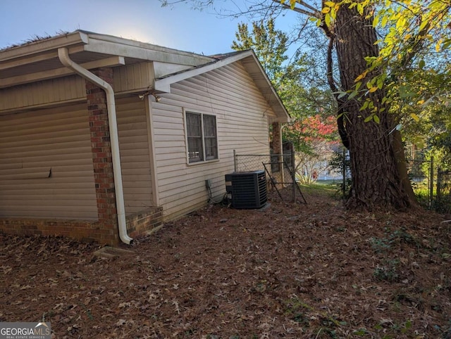 view of side of property featuring central AC unit