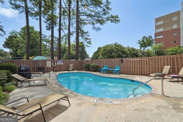 view of pool featuring a patio