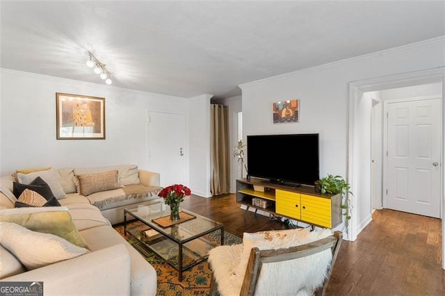 living room with dark hardwood / wood-style flooring and ornamental molding