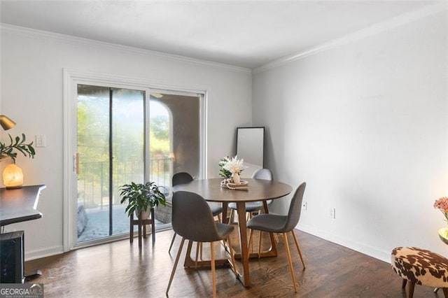 dining room featuring dark hardwood / wood-style floors and ornamental molding