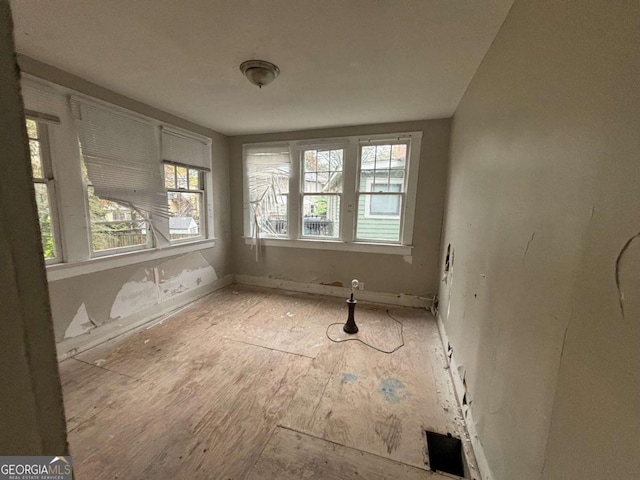 empty room with light hardwood / wood-style floors