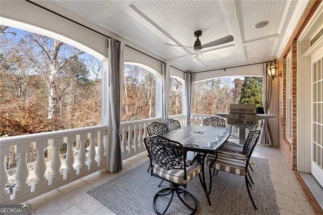 sunroom featuring ceiling fan and coffered ceiling