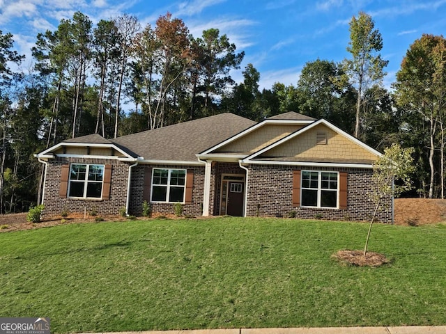 craftsman-style house with a front lawn