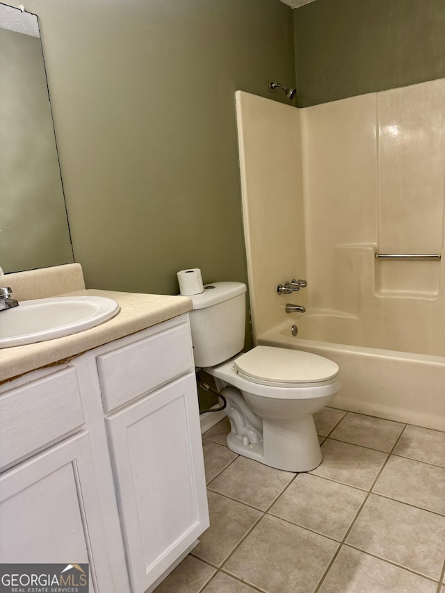 full bathroom featuring tile patterned flooring, vanity, bathtub / shower combination, and toilet