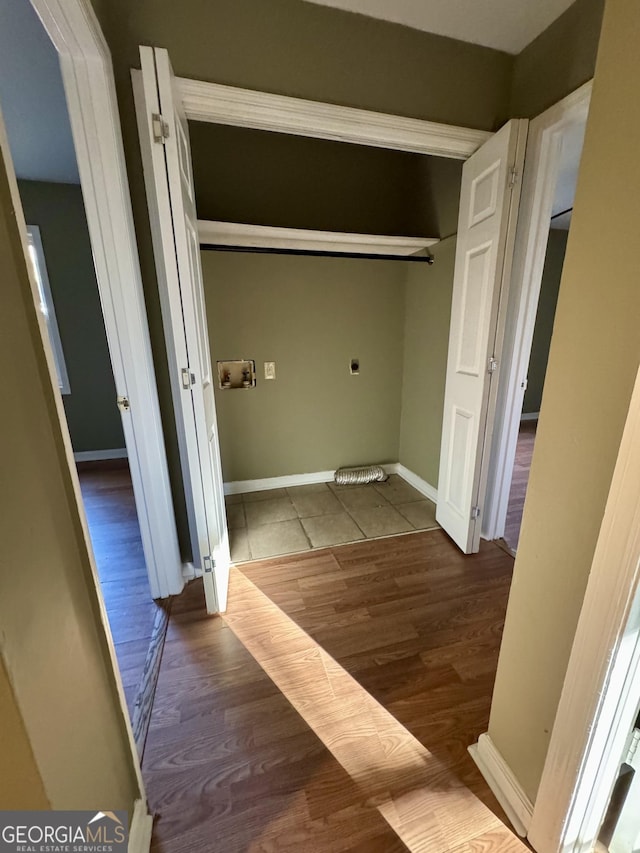 washroom featuring wood-type flooring, hookup for a washing machine, and electric dryer hookup