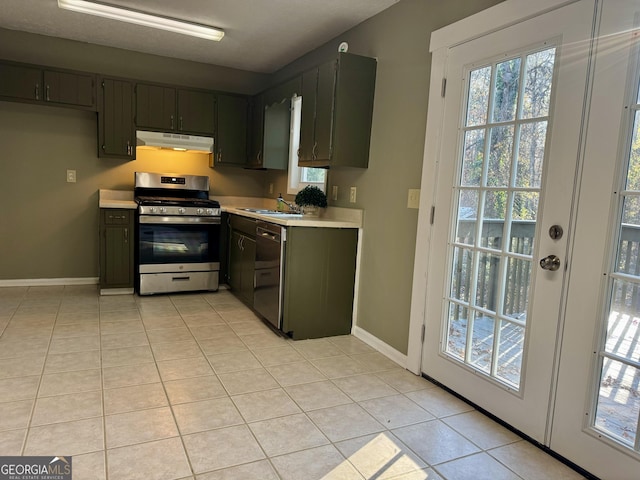 kitchen featuring sink, light tile patterned floors, and stainless steel appliances