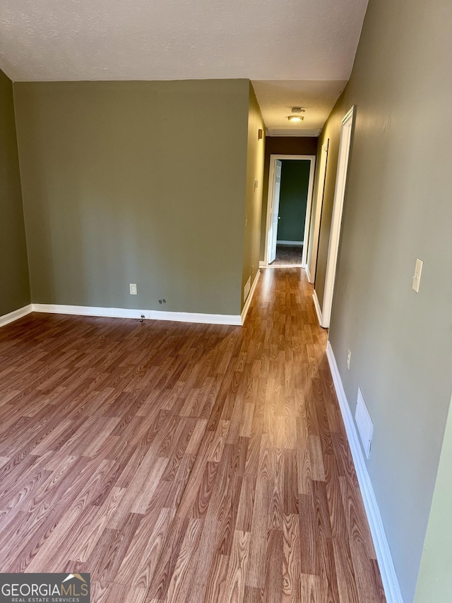 interior space with light hardwood / wood-style floors and a textured ceiling