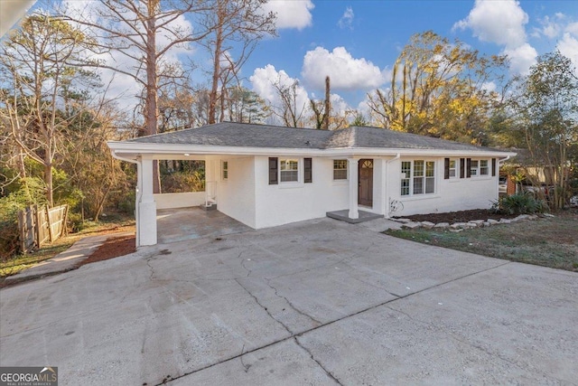 single story home with a carport