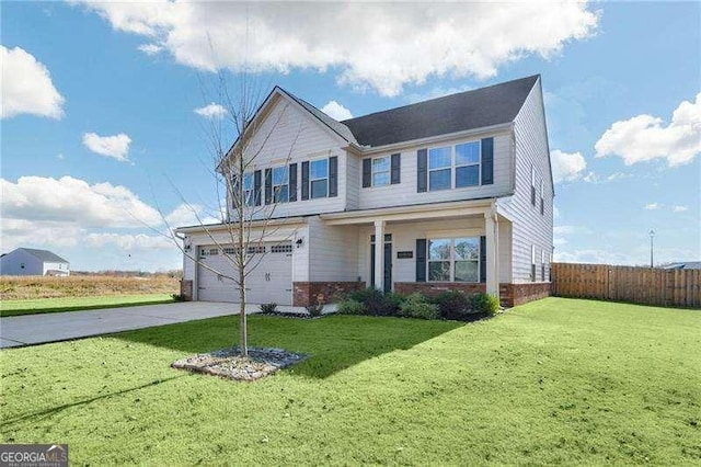 view of front of house with a garage and a front lawn