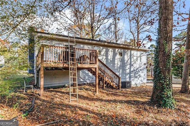 rear view of house with a wooden deck