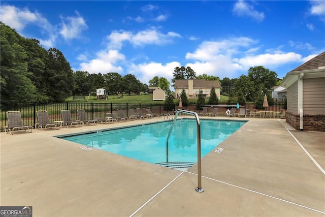 view of swimming pool with a patio