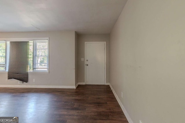 foyer with dark wood-type flooring