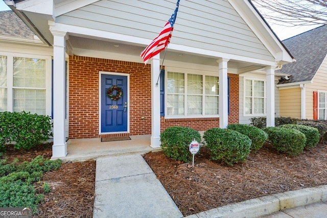 entrance to property with brick siding