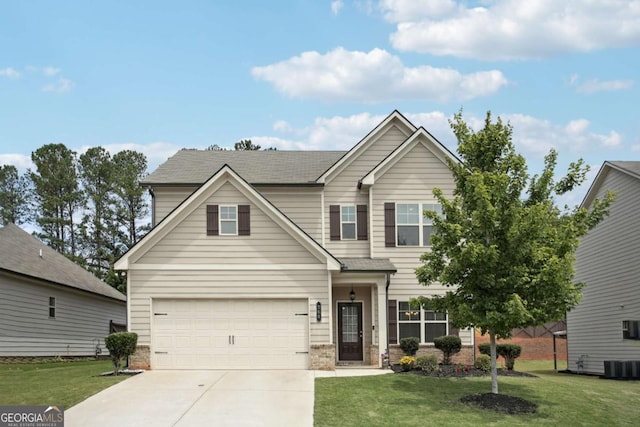 view of front of home featuring cooling unit, a garage, and a front lawn