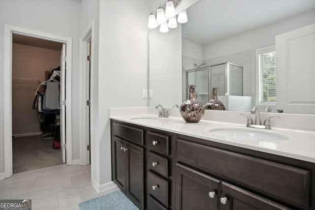 bathroom with vanity and an enclosed shower