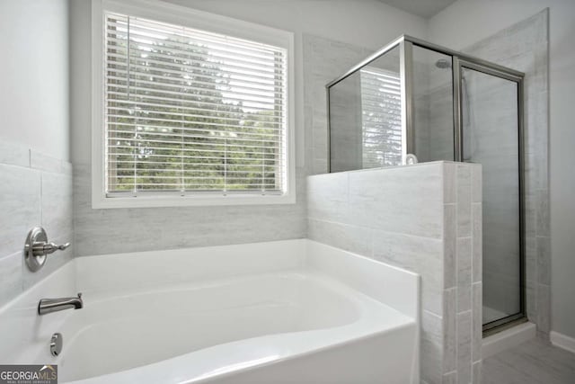 bathroom featuring plus walk in shower