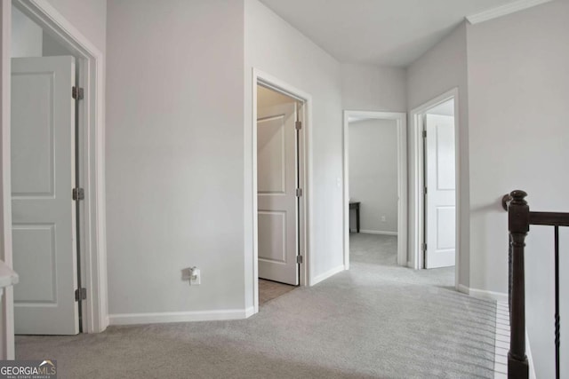 hallway featuring light carpet