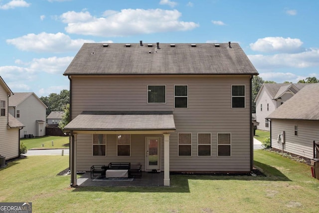 back of house featuring outdoor lounge area, cooling unit, a patio area, and a lawn