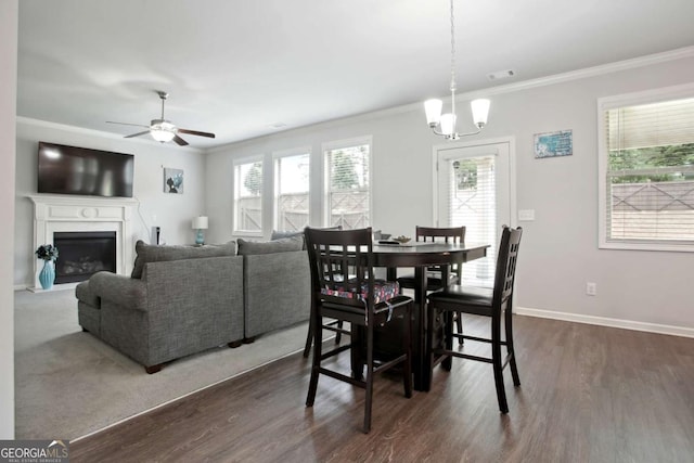 dining room featuring dark hardwood / wood-style floors, plenty of natural light, and crown molding