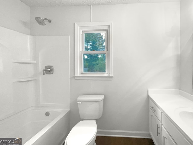 full bathroom featuring vanity, toilet, shower / tub combination, and a textured ceiling