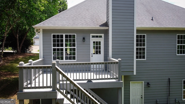 back of property featuring a deck