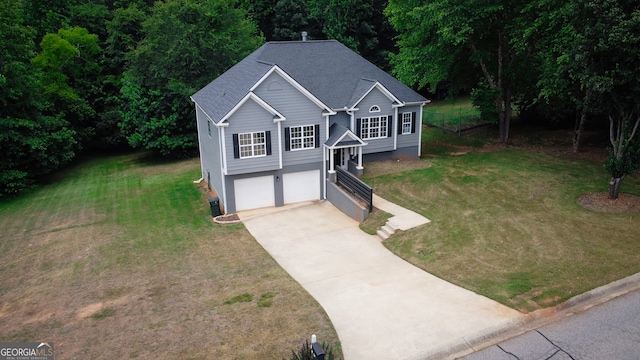 view of front of house featuring a garage and a front yard