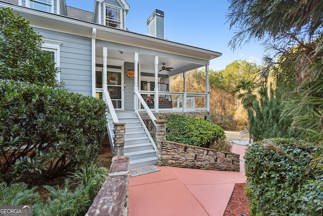 property entrance with covered porch and ceiling fan