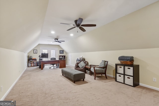 carpeted office featuring vaulted ceiling and ceiling fan