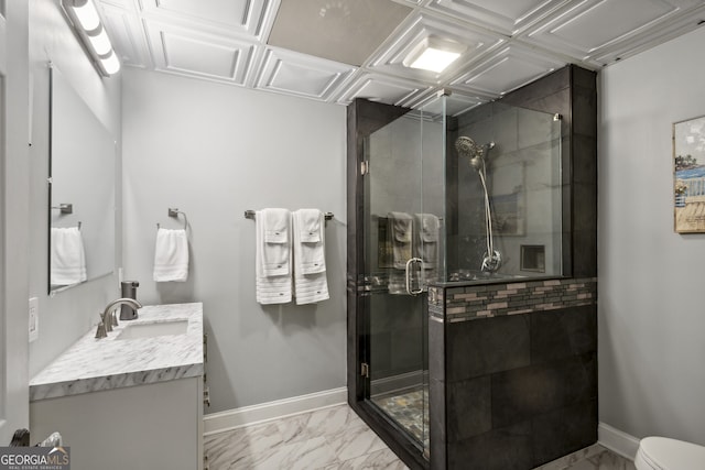 bathroom featuring vanity, toilet, and a shower with door